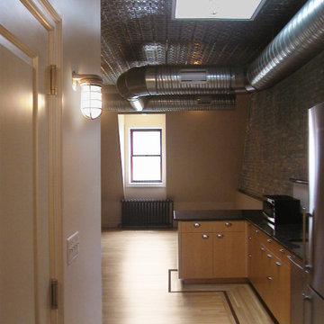 Open Loft Suite Kitchen and Living Area with Exposed Ductwork