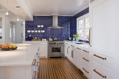Beach style kitchen photo in Bridgeport with paneled appliances
