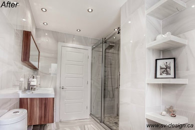 Double shower - mid-sized modern master gray tile and ceramic tile double shower idea in Montreal with raised-panel cabinets and a hot tub