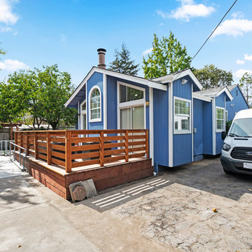 Accessible Blue Home Exterior with Wheelchair Ramp and Wood Deck | Novato