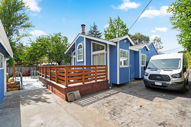 Accessible Blue Home Exterior with Wheelchair Ramp and Wood Deck | Novato