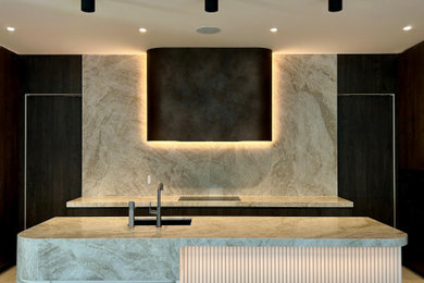 Inspiration for a modern galley kitchen pantry in Sydney with an undermount sink, flat-panel cabinets, dark wood cabinets, quartz benchtops, engineered quartz splashback, black appliances, ceramic floors and with island.