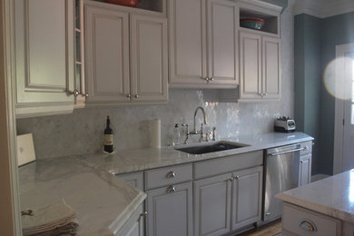 Kitchen - contemporary light wood floor kitchen idea in DC Metro with a drop-in sink, shaker cabinets, marble countertops, glass tile backsplash and stainless steel appliances