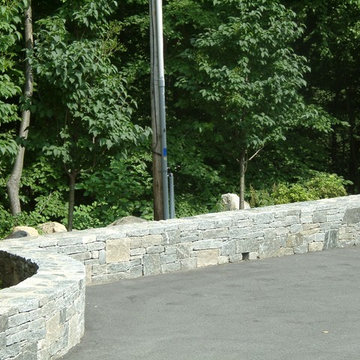 Driveway stone wall minimizes