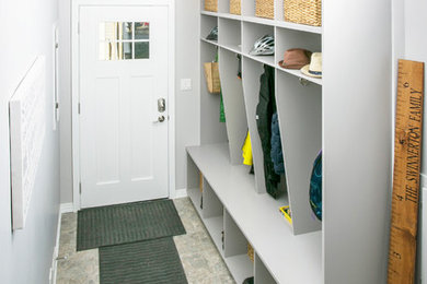Example of a trendy mudroom design in Edmonton with gray walls