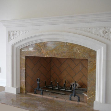 Limestone and marble hand-carved fireplace.