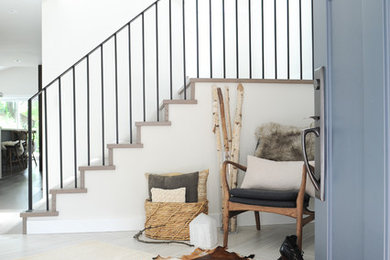 Large transitional vinyl floor entryway photo in Vancouver with white walls and a blue front door