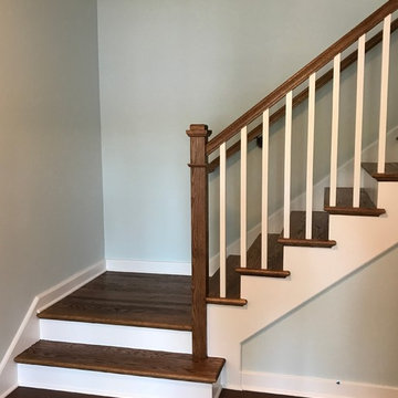 Straight And Platform Stair With Wooden Balustrade