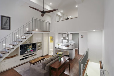Inspiration for a mid-sized transitional open concept dark wood floor family room remodel in New York with white walls and no tv