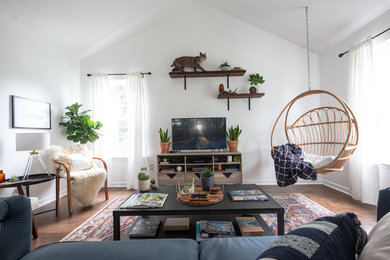 Example of a trendy brown floor living room design in Nashville