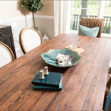 Transitional Dining Room With a Traveled Vibe