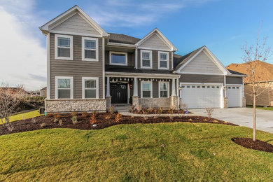 Inspiration for a large craftsman gray two-story concrete fiberboard exterior home remodel in Chicago with a shingle roof