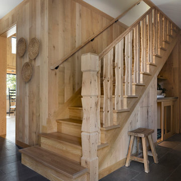 White Oak Paneling and Stair Post in Modern Rustic Staircase Design