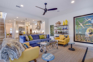 Inspiration for a modern open concept concrete floor living room remodel in Austin with white walls, a standard fireplace, a tile fireplace and a wall-mounted tv