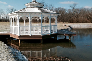 Patio - large transitional backyard patio idea in Columbus with a gazebo