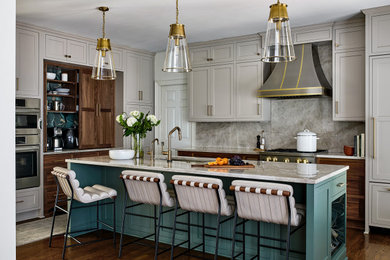 Mid-sized transitional medium tone wood floor kitchen photo in DC Metro with beige backsplash and an island
