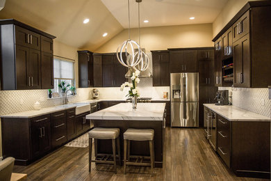 Open concept kitchen - large contemporary l-shaped open concept kitchen idea in Philadelphia with a farmhouse sink, shaker cabinets, dark wood cabinets, quartz countertops, white backsplash, ceramic backsplash, stainless steel appliances and an island