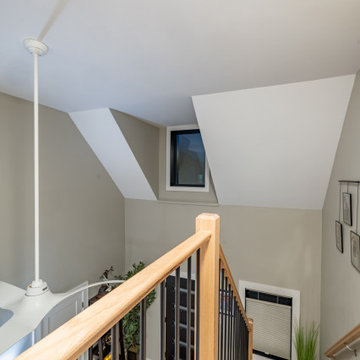 Open Staircase with Modern Railing and Light-Filled Entry – Cape Ann MA