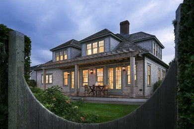 Mid-sized coastal beige two-story wood exterior home idea in Boston with a hip roof