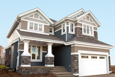 Example of a large arts and crafts exterior home design in Edmonton
