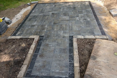 Patio - backyard concrete paver patio idea in Cleveland