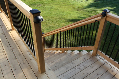 Deck - large traditional backyard deck idea in Detroit with no cover