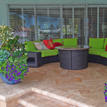 High-end "beachy" style backyard transformation with new travertine deck
