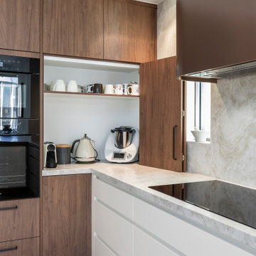 Contemporary Kitchen with curved elements, timber and bronze