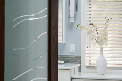 Inspiration for a large modern master beige tile and porcelain tile porcelain tile and blue floor bathroom remodel in Chicago with shaker cabinets, white cabinets, a two-piece toilet, blue walls, an undermount sink, quartz countertops and white countertops