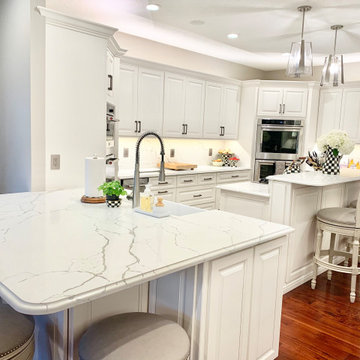 Ivory White Kitchen With Marble Look Quartz Counters and Splash
