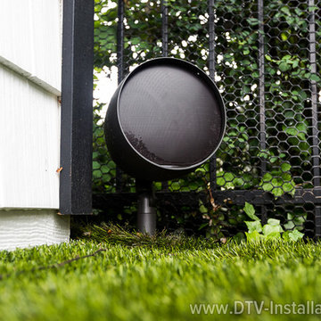 Episode® Landscape Series Satellite Speaker on the New Yorker's backyard