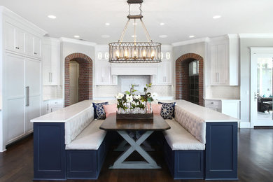 Inspiration for a traditional dining room in Kansas City with grey walls, dark hardwood floors and no fireplace.