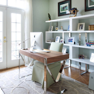 Mid-sized contemporary study room in DC Metro with blue walls, medium hardwood floors, a freestanding desk, a two-sided fireplace and brown floor.