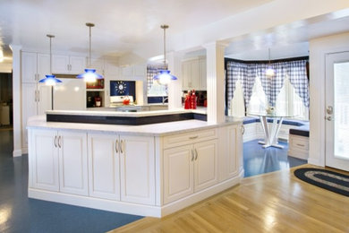 Inspiration for a transitional l-shaped blue floor eat-in kitchen remodel in Other with raised-panel cabinets, white cabinets, blue backsplash, white appliances, an island and white countertops