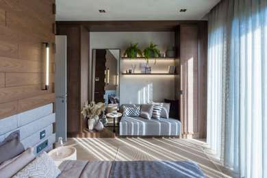 Inspiration for a large contemporary master medium tone wood floor bedroom remodel in Other with gray walls