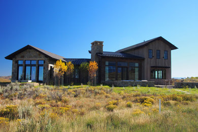 Farmhouse exterior home idea in Denver