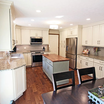 Cream Kitchen with Green Island with Butcher Block Countertop