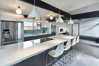 Design ideas for a large modern single-wall eat-in kitchen in San Francisco with a single-bowl sink, flat-panel cabinets, grey cabinets, quartz benchtops, blue splashback, ceramic splashback, stainless steel appliances, linoleum floors, with island and grey floor.