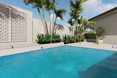 Diseño de piscina elevada grande rectangular en patio trasero con paisajismo de piscina y losas de hormigón
