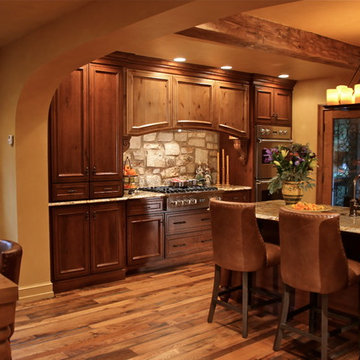 Mediterranean Luxury Kitchen Remodel | Stone Accents & Arched Detailing