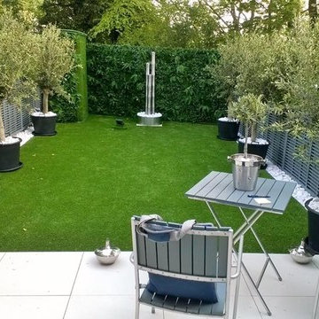 Artificial hedge & grass create maintenance free garden