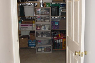 Walk-in closet - mid-sized gender-neutral concrete floor walk-in closet idea in DC Metro