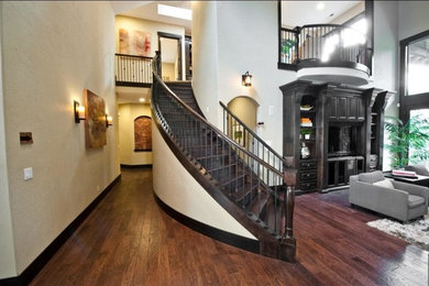Example of a mid-sized transitional wooden curved wood railing staircase design in Portland with wooden risers