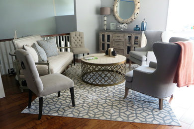Inspiration for a mid-sized coastal formal and open concept medium tone wood floor and brown floor living room remodel in Orange County with blue walls, a concrete fireplace and no tv