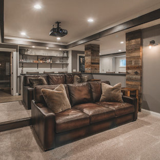 Home theater - mid-sized rustic open concept carpeted and beige floor home theater idea in Columbus with gray walls and a projector screen