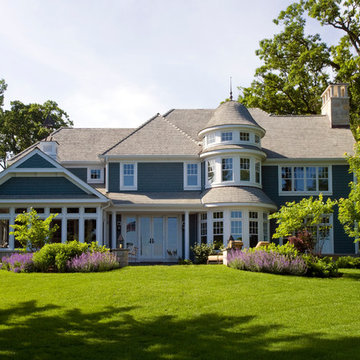 Rear Elevation Features Two Story Turret, Cottage Style Windows and French Doors