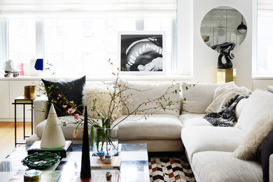 Living room - mid-sized contemporary formal and open concept light wood floor living room idea in New York with white walls