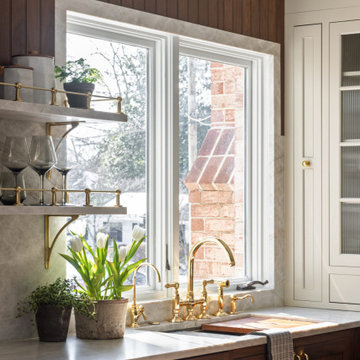 Luxury Transitional Kitchen with Walnut Cabinetry, Marble Slab Backsplash & Bras