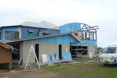 Photo of a beach style home design in Other.