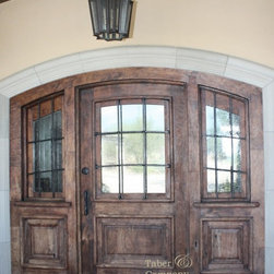 Wood entry door with true sidelights, seeded glass and hand forged iron. - Front Doors